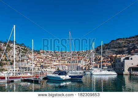 View of vacation house in marina Porto piccolo Sistiana Italy with sailing boats