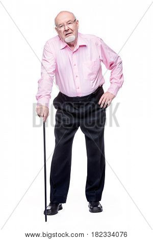 The old man standing with walking stick. Back hurts, radiculitis. Health care for the elderly people.