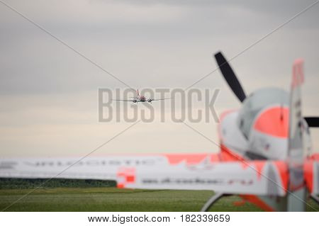 A large twin-engined aircraft approaches the landing