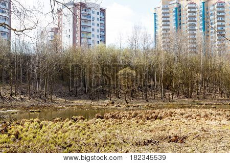 Abandoned park in the center of the city in early spring in warm sunny weather