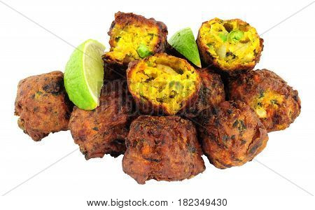 Group of fried vegetable pakora with chilli sauce dip isolated on a white background