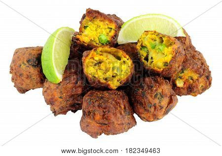 Group of fried vegetable pakora with chilli sauce dip isolated on a white background
