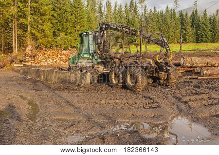 Podbanske Slovakia - August 16 2014: Forwarder is a forestry vehicle that carries big felled logs from the stump to a roadside landing.