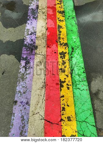Abstract colorful stripes on the asphalt