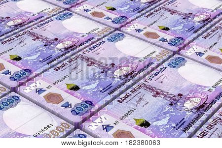 Rwandan francs bills stacked background. 3D illustration.