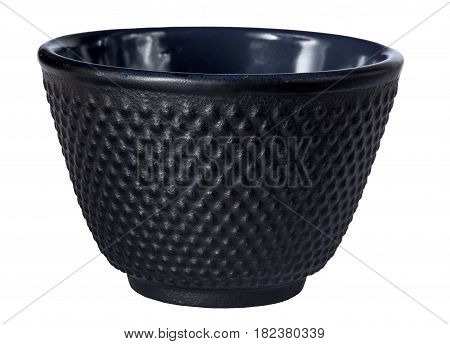 Black traditional tea cup of cast iron isolated on white background.