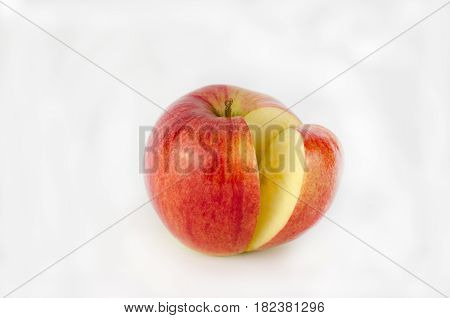 Red apple and slice isolated on white background