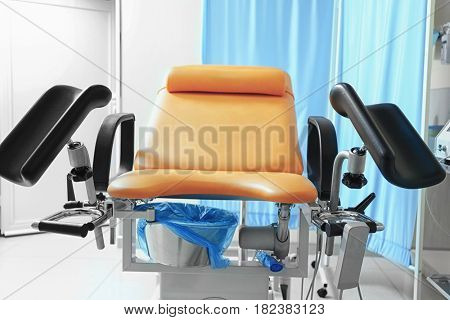 Gynecological examination chair in room