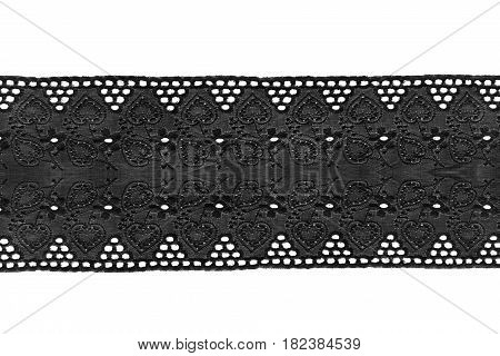 Black embroidered decorative lacy ribbon on white background
