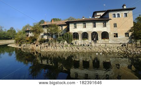 Country house along the Naviglio Grande of Turbigo (Milan Lombardy Italy) at fall with geese