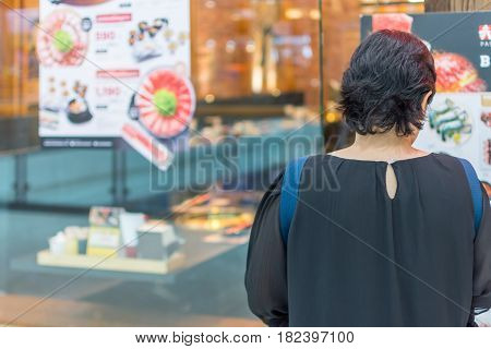 Asia Women Stand At Front Of Barbecue Restaurant