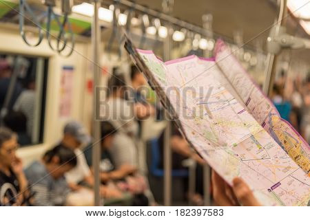 Mrt Subway Train, Tourist Looks Location On Map