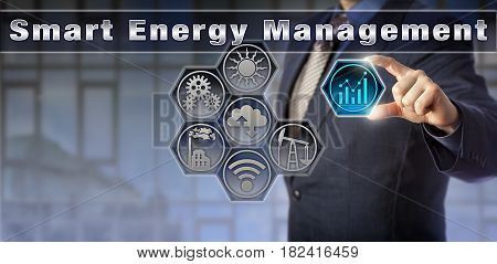 Blue chip corporate manager is remotely controlling energy and power-related information in a virtual Smart Energy Management matrix interface. Industrial technology and internet of things concept.