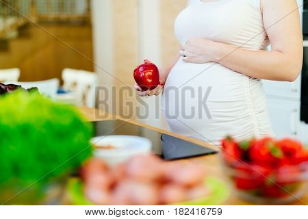 Pregnant woman healthy eating vegetables and fruit