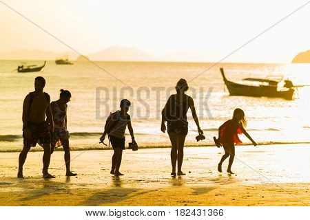 Ao Nang Krabi Thailand - March 26 2017: People on the Ao Nang beach at sunset in Krabi province Thailand