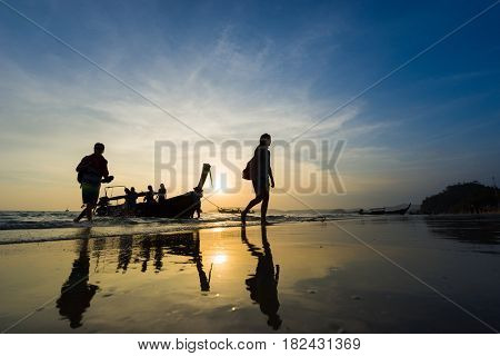Ao Nang Krabi Thailand - March 03 2017: People on the Ao Nang beach at sunset in Krabi province Thailand