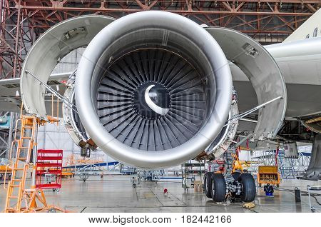 Jet Engine Open And Ready For Maintenance Inside Hangar