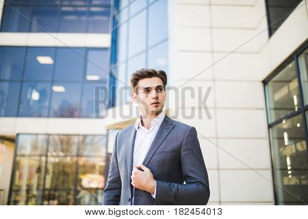 Successful Business Man Outdoors In Front Of Office Building