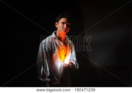 The handsome magician is casting a spell.