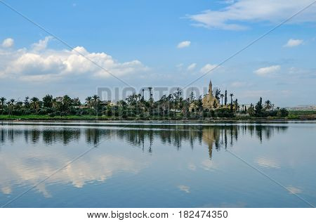 Hala Sultan Tekke Mosque beside Aliki Salt Lake with reflections. Taken in the Springtime when visiting Larnaca in Cyprus.