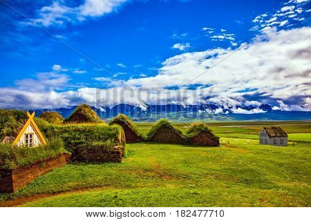  Farm Museum in Glaumbaer. The picturesque village of old houses covered with turf and grass. The concept of cultural and historical tourism