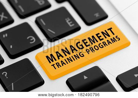 MANAGEMENT TRAINING PROGRAMS button on keyboard, closeup