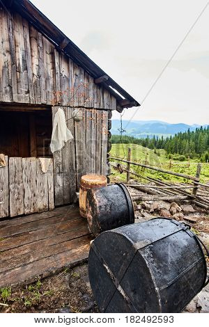 Mountain hut and vat for the production of cheese in Carpathian village