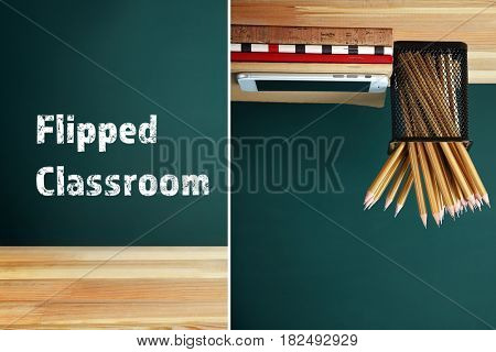 Flipped classroom concept. Inversed stationery with smartphone on blackboard background
