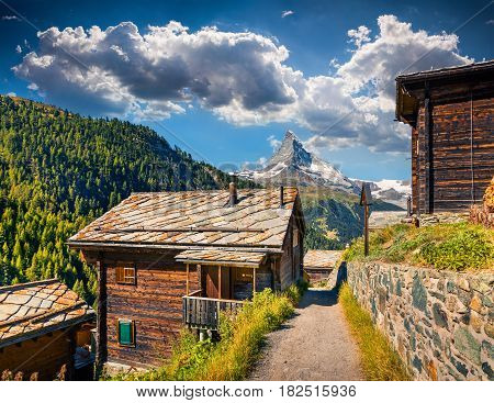 Sunny summer morning in Zermatt village with Matterhorn (Monte Cervino Mont Cervin) peak on backgroud. Beautiful outdoor scene in Swiss Alps Valais canton Switzerland Europe.