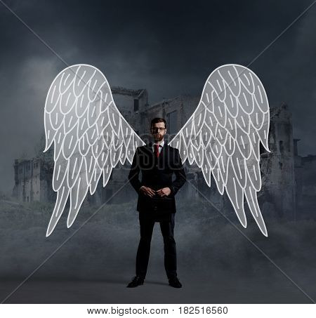 Business angel standing over apocalyptic background. Crisis, default, setback concept.