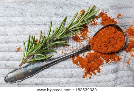Pepper Powder And Rosemary On A Spoon Macro