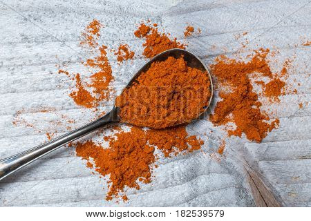 Red Pepper powder on a spoon macro detail