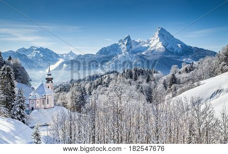 Panoramic View Of Beautiful Winter Landscape In The Bavarian Alps With Pilgrimage Church Of Maria Ge