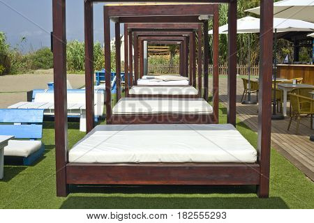 Lounger beds on beach relaxing resort south of Spain