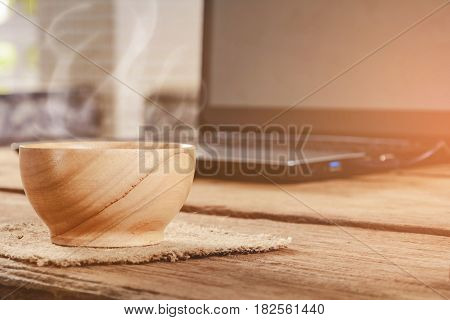 coffee cup and notebook on wood table and good morning