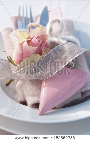 Close up of a table decoration with pink heart for a mother's day dinner