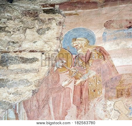 CASTELSEPRIO, ITALY - JUNE 25, 2016: The archeological area of Castelseprio (Varese Lombardy Italy): ruins of a village destroyed in the 13th century. Unesco World Heritage Site. The church mural paintings.