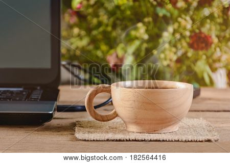 Coffee Cup And Notebook On Wood Table