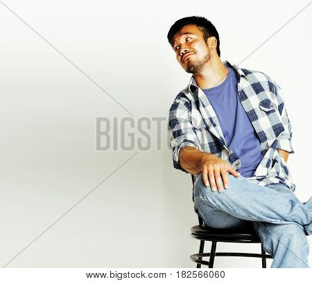 young cute asian man on white background gesturing emotional, pointing, smiling, lifestyle people concept, cheerfull mature guy making funy faces close up