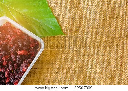 Red Mulberry on sackcloth and Healthy fruit