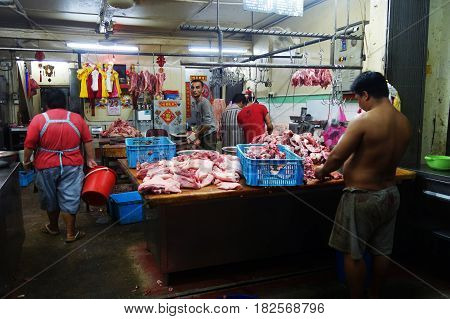 Shopkeepers In A Traditional Butcher Market Stall
