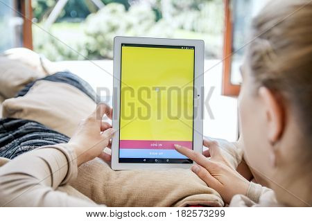 Wroclaw, Poland- April 10Th, 2017:  Woman Launches Snapchat Application On Lenovo Tablet. Snapchat I