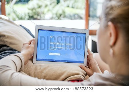 Wroclaw, Poland- April 10Th, 2017:  Woman Launches Twitter Application On Lenovo Tablet. Twitter  Is