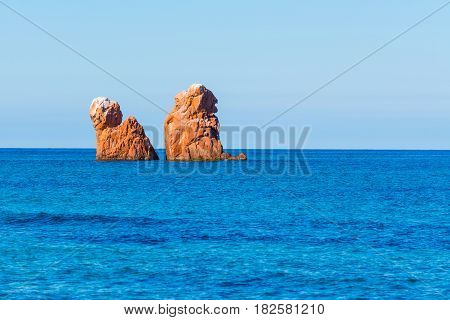 orange sea stacks in Cea Beach, Sardinia