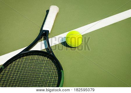 The green tennis ball on a tennis court