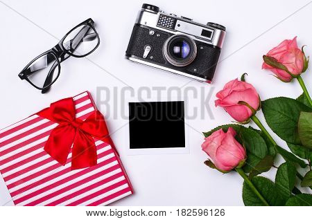 Romantic Concept On White Background: Roses, Gift And Old Camera.