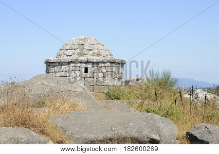 Circular watchtower with walls and stone vault at the top of the summit of Facho Mountain in Cangas in the province of Pontevedra Galicia Spain.
