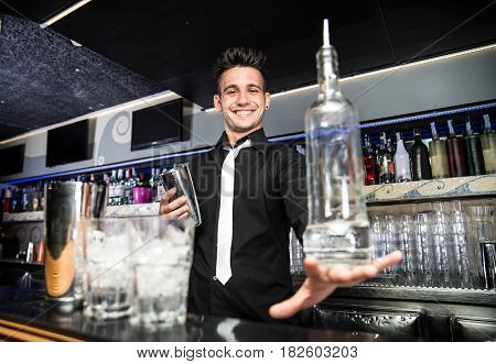 Flair bartender in action behind the club bar