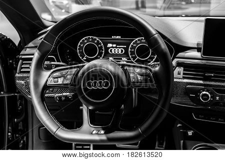 BERLIN - NOVEMBER 09 2016: Showroom. The dashboard of the compact executive car Audi S5 Sportback 3.0 TFSI quattro tiptronic. Black and white. Produced since 2013 (facelifted).