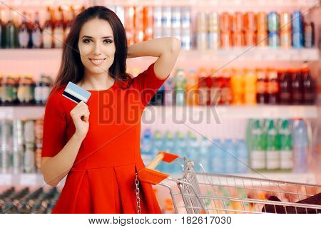 Happy Customer Holding Credit Card in a Supermarket